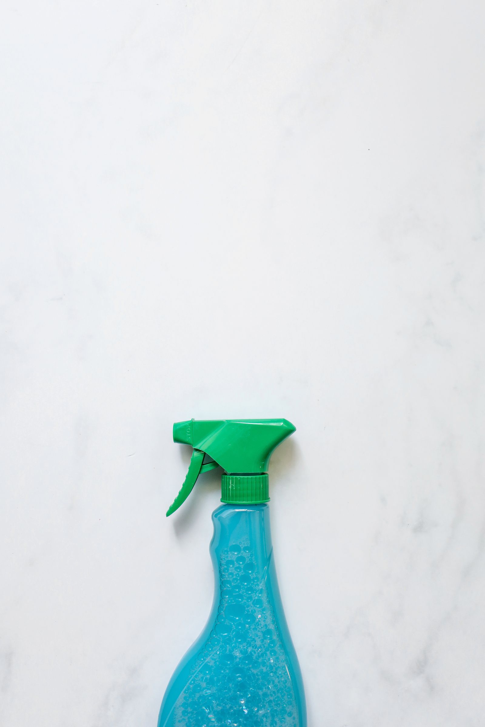Biodegradable detergent bottle on a plain ground