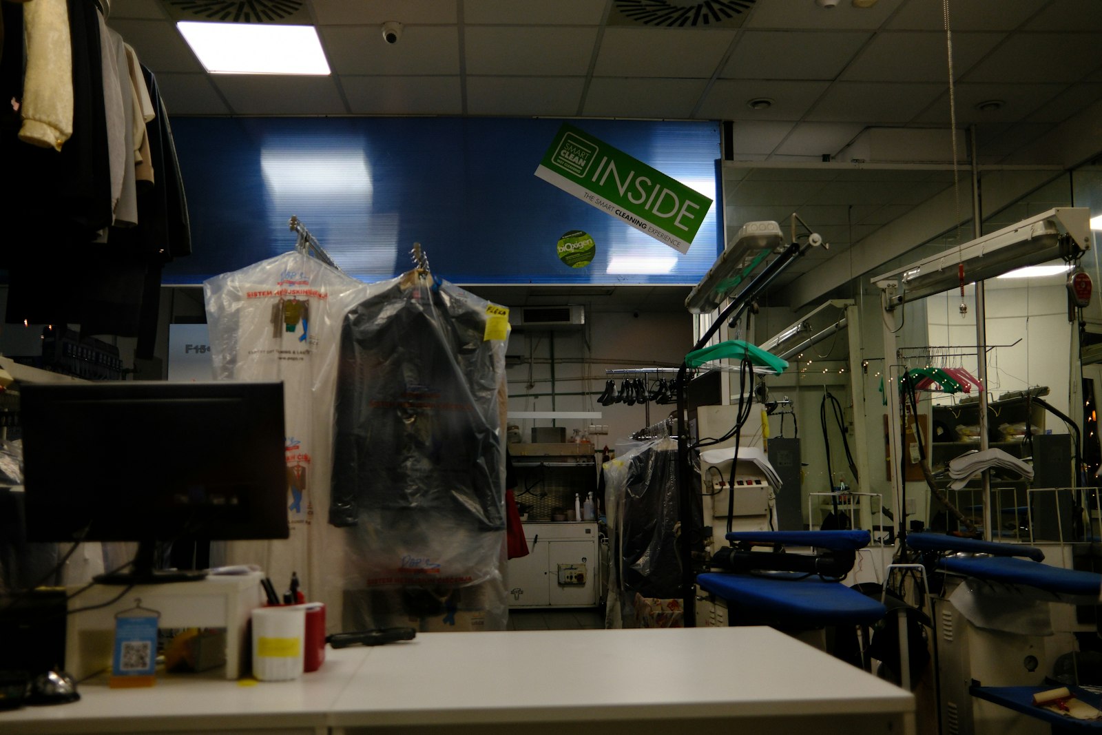 Cleaning equipment and covered garments inside the shop