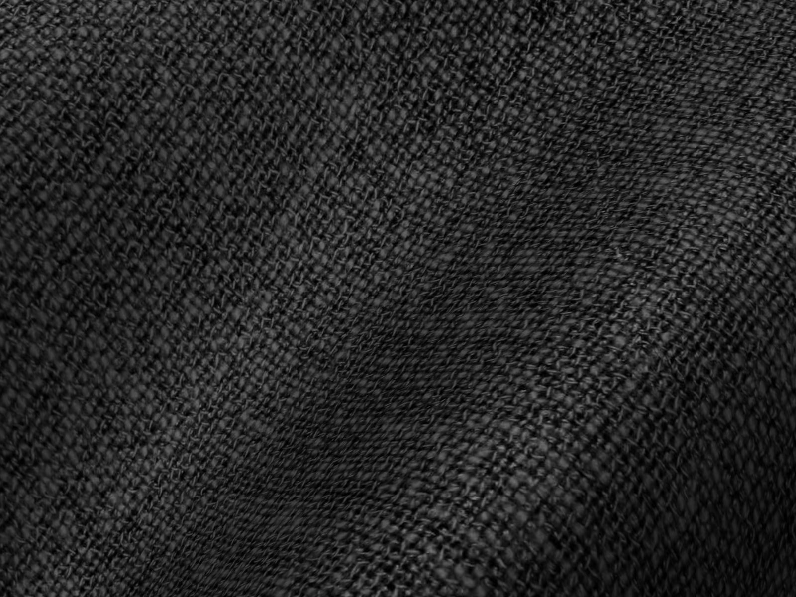 Rippled black fabric photographed in close detail