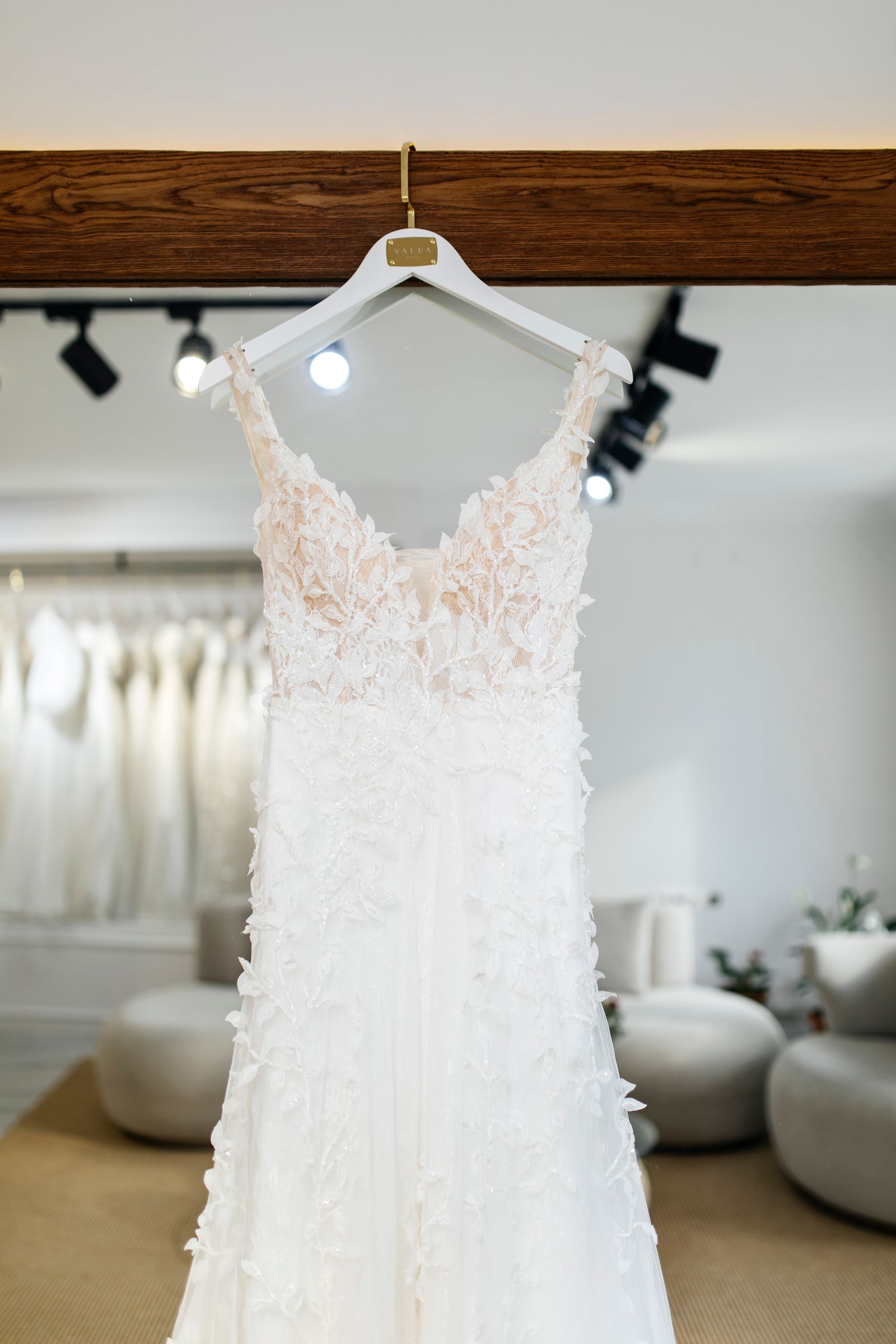 A wedding gown on its hanger after cleaning